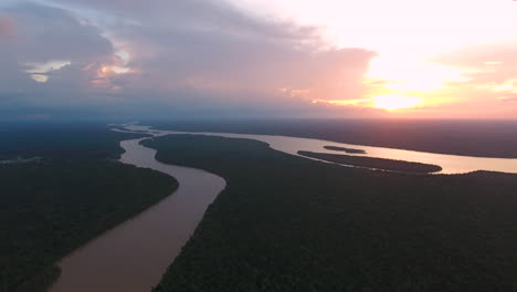 Drone-shot-over-Mana-river-Guiana-Suriname-during-sunset.-Amazonian-forest